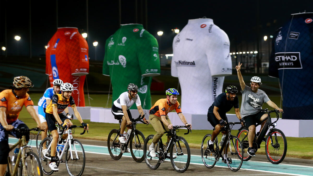 Shaikh Nahyan bin Zayed Al Nahyan, Chairman of Abu Dhabi Sports Council, with cyclists at the Yas Marina Circuit. 