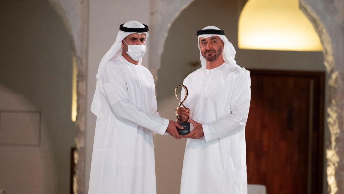 Sheikh Mohamed presents an award to Ali Mohamed Al Ketbi, who received it on behalf of his father, the late Mohamed Al Ketbi.