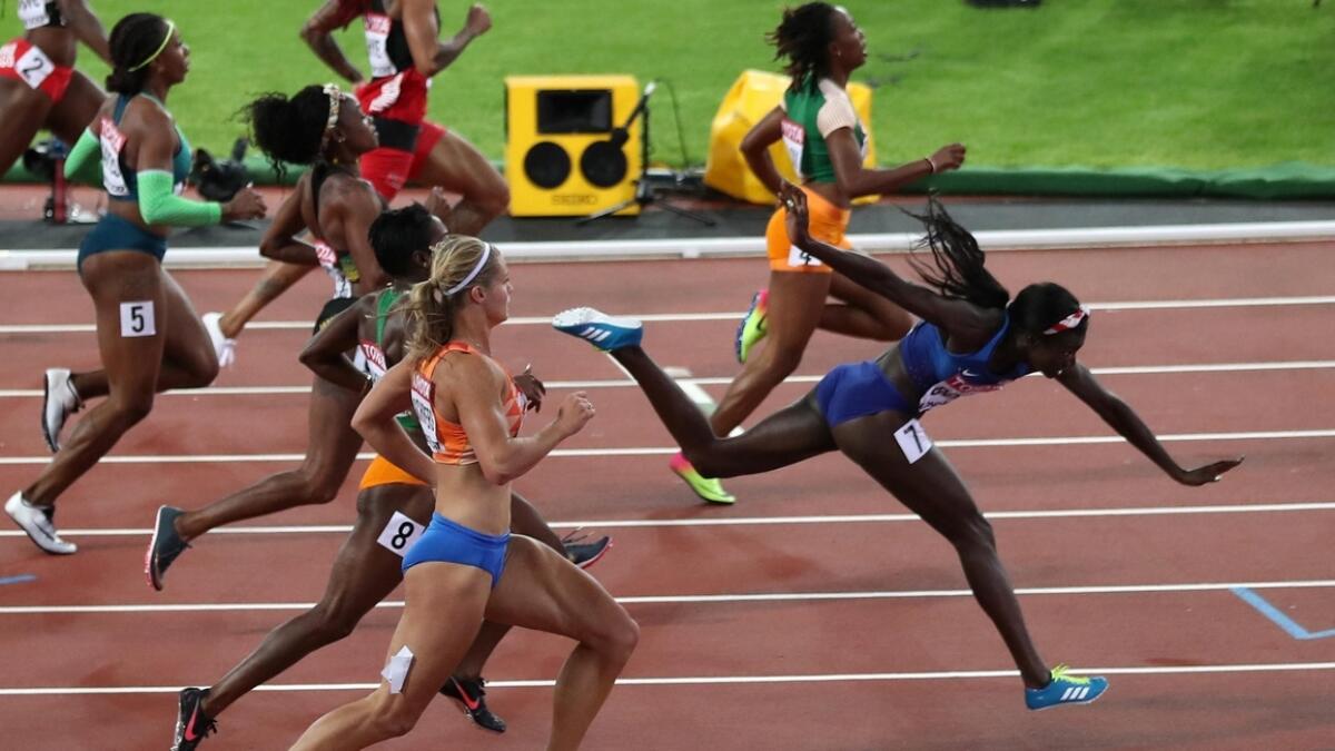 America's Tori Bowie timed her dip perfectly to win the women's 100 metres world championship gold (Reuters)