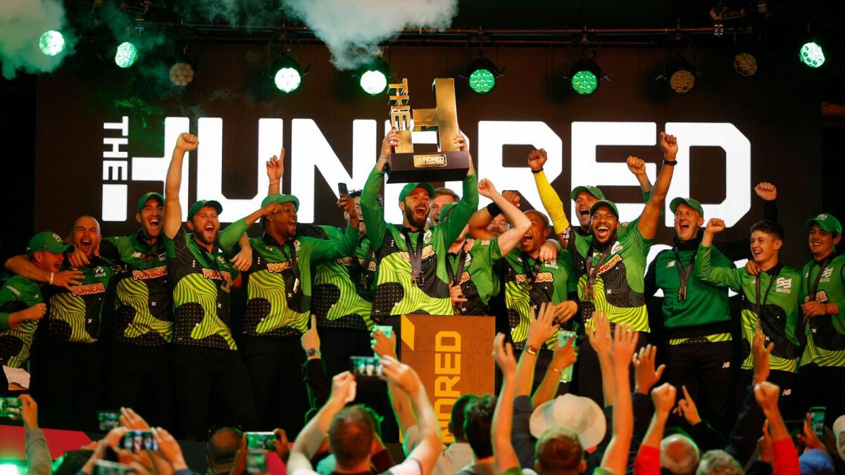 Southern Brave players celebrate with the trophy after winning The Hundred final against Birmingham Phoenix. — Reuters