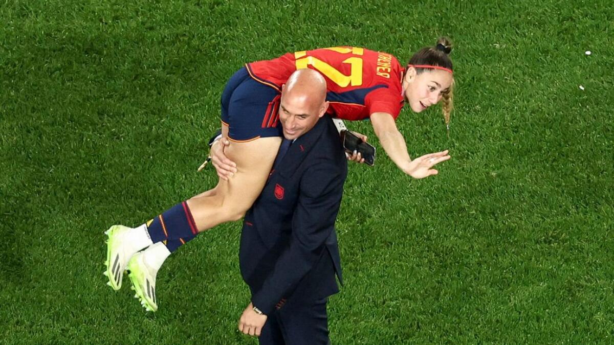 President of the Royal Spanish Football Federation Luis Rubiales carrying Spain's Athenea del Castillo Beivide on his shoulder as they celebrate winning the 2023 Women's World Cup. - AFP