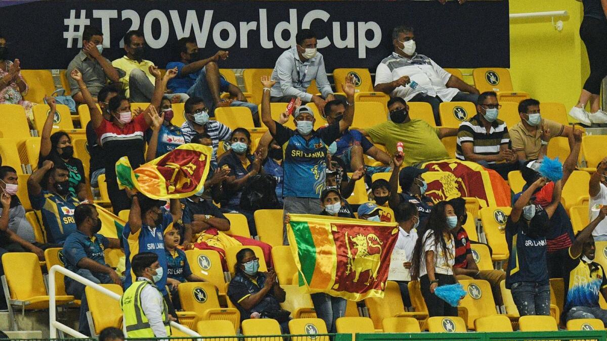 Sri Lankan fans cheer from the stands during the T20 World Cup match between Sri Lanka and Ireland at the Zayed Cricket Stadium in Abu Dhabi on Wednesday. — AFP