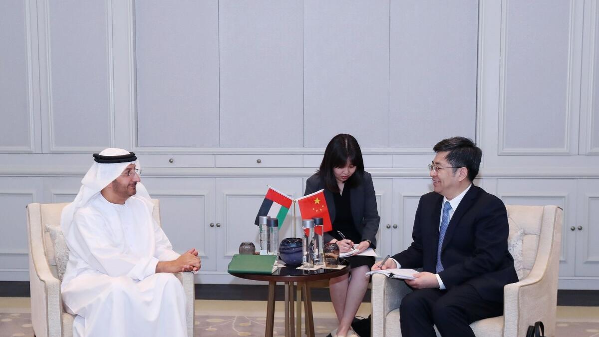 Abdullah Ahmad Al Saleh meets with Zhang Xiangchen in Dubai. - WAM