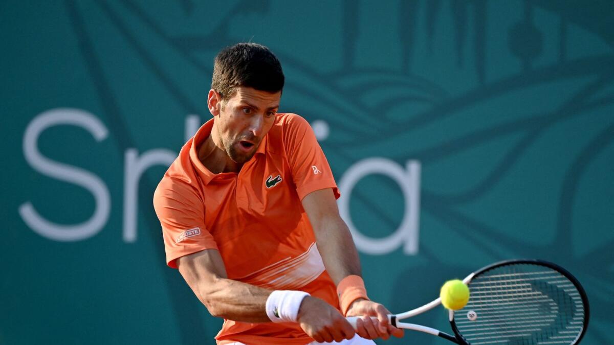Novak Djokovic plays a return to Laslo Djere during their match. (AFP)