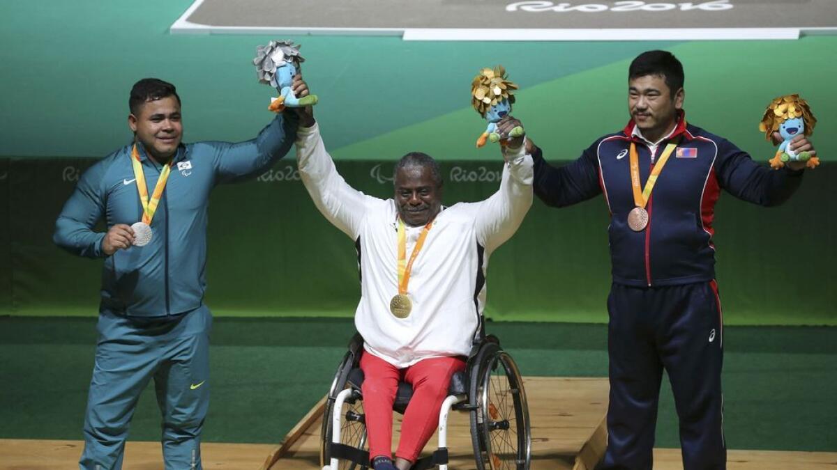 (from left) Silver medalist Evanio da Silva of Brazil, gold medalist Mohammed Khalaf of the UAE, and bronze medalist Sodnompiljee Enkhbayar of Mongolia pose with their medals.