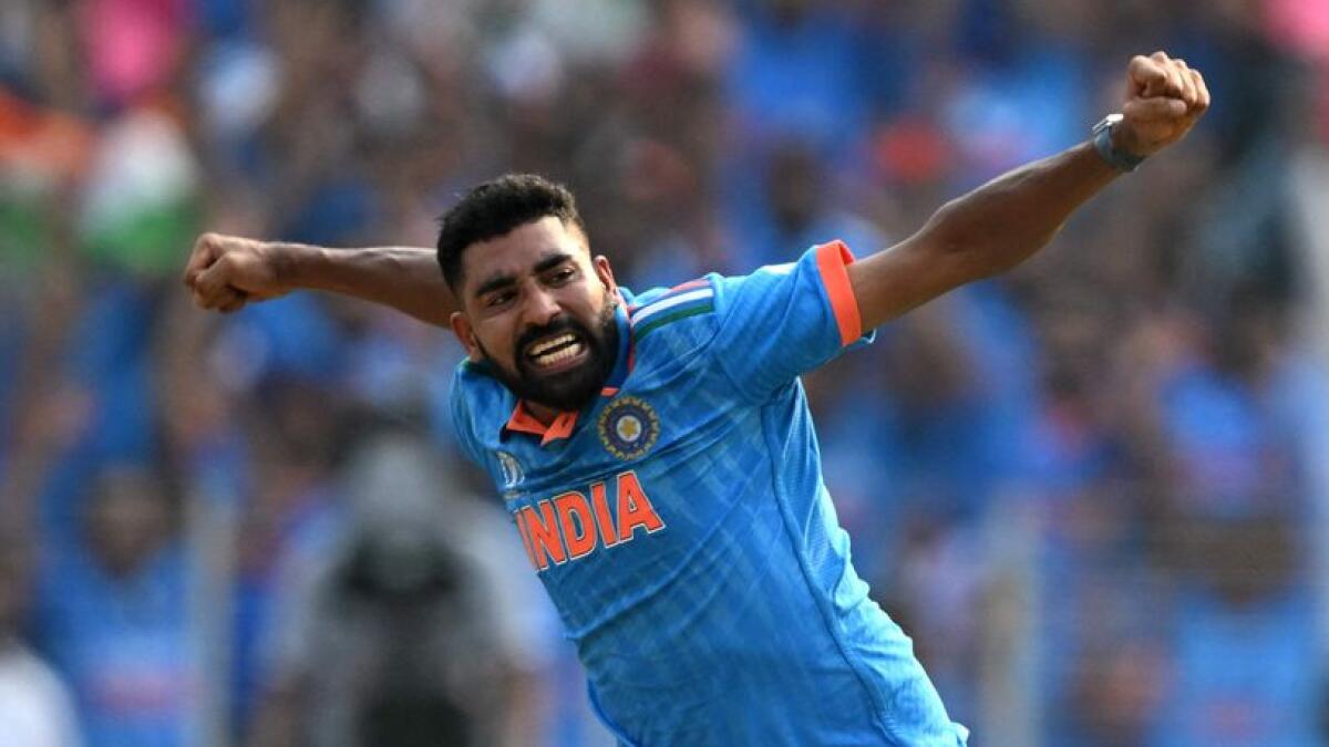 Mohammed Siraj celebrates after taking the prize  wicket of Pakistan's captain Babar Azam. - AFP