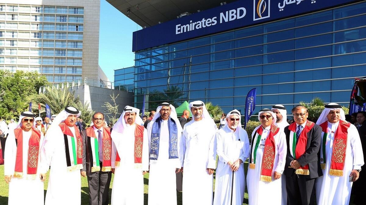 Officials and staff of Emirates NBD celebrating the UAE's National Day.
