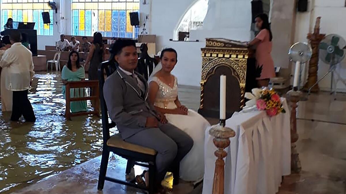Video: Filipino couple gets married in flooded church