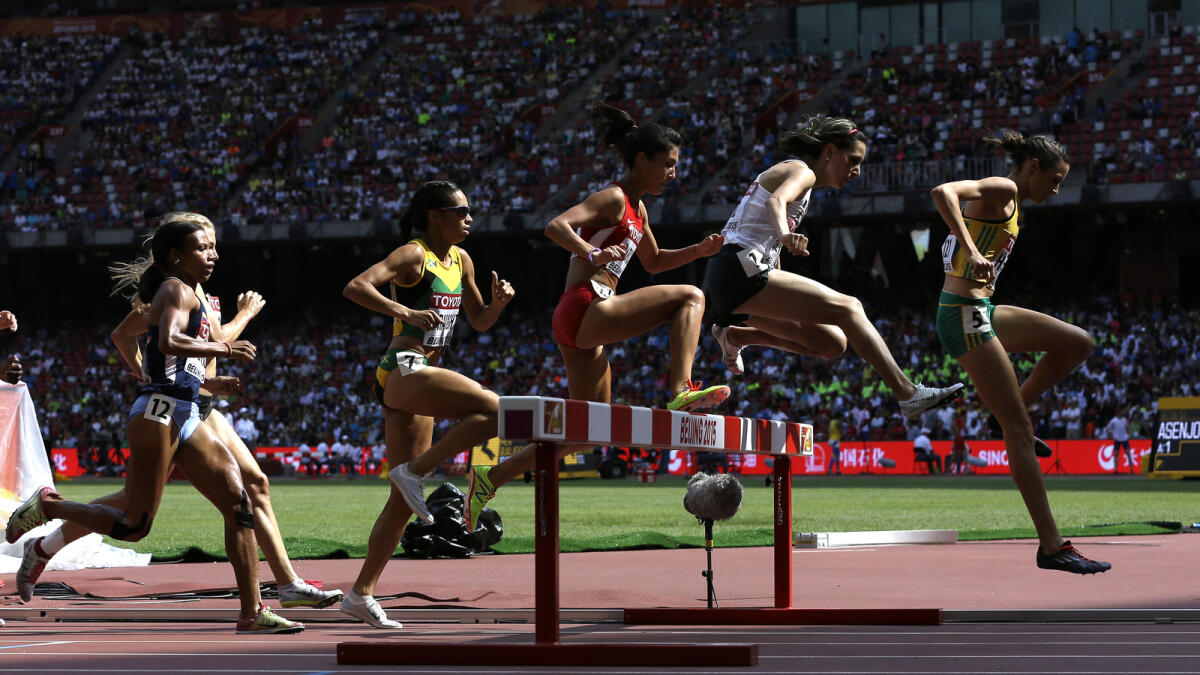 Competitors clear a jump in round one of the women?s 3000m steeplechase at the World Athletics Championships at the Bird's Nest stadium in Beijing, on Aug. 24, 2015. 