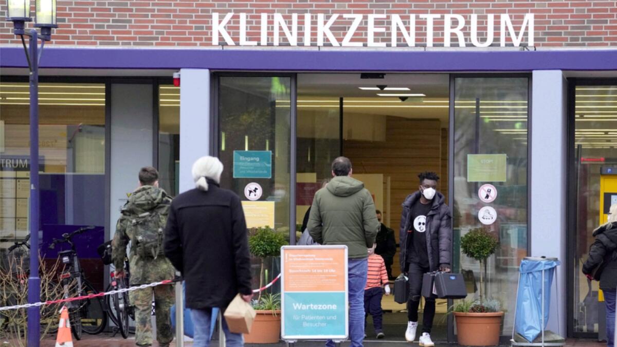People enter the Westerstede Clinical Centre, a military-civilian hospital in Westerstede, northwest Germany. — AP