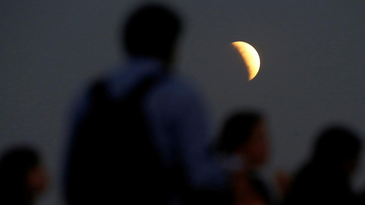 A partial lunar eclipse is seen in Brasilia, Brazil July 16, 2019. Reuters 