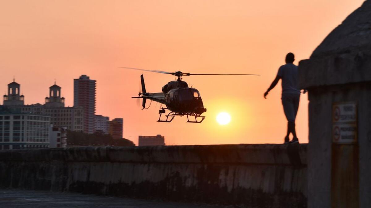 Cuban looks at one of the helicopters from Universal Studios of Hollywood used during the shooting of Fast and Furious 8 in Havana