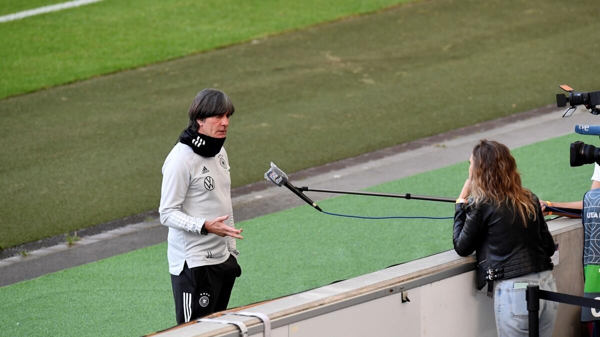Germany's Coach Joachim Loew answers journalists' questions before a training session
