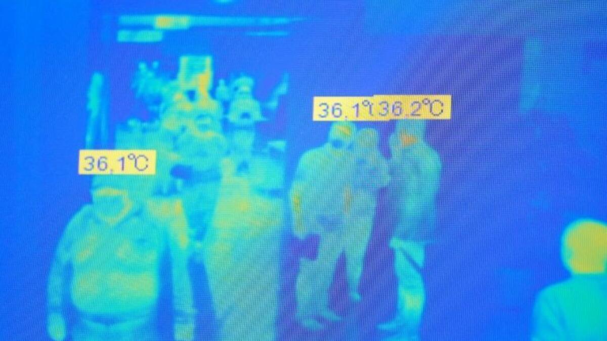The robot's screen, showing the temperatures of the people it can see.
