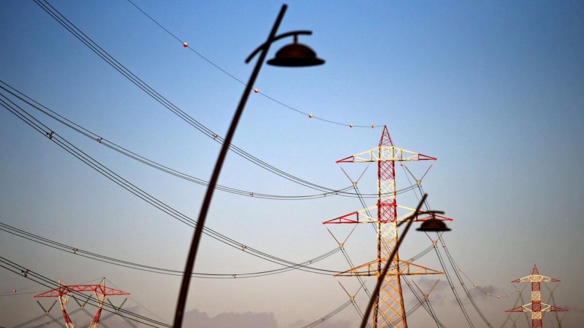 Power lines connecting pylons of high-tension electricity are seen in Montalto Di Castro, Italy
