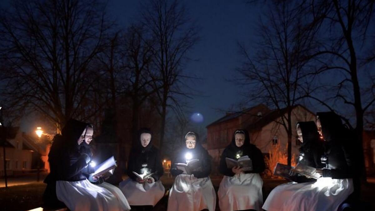 Women dressed in traditional clothes of the Slavic ethnic minority community of Sorbs meet early on Easter Sunday to sing in front of a church in Schleife, eastern Germany. Photo: Reuters