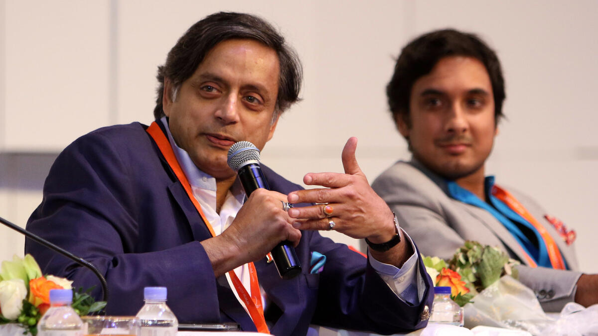 Shashi Tharoor and his son Kanishk Tharoor during their session with students at the book fair on Monday.  
