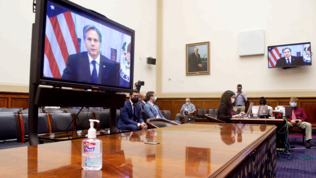 US Secretary of State Antony Blinken appears on a television screen as he testifies virtually on the US withdrawal from Afghanistan during a House Foreign Affairs Committee hearing on Capitol Hill in Washington, DC. — AFP