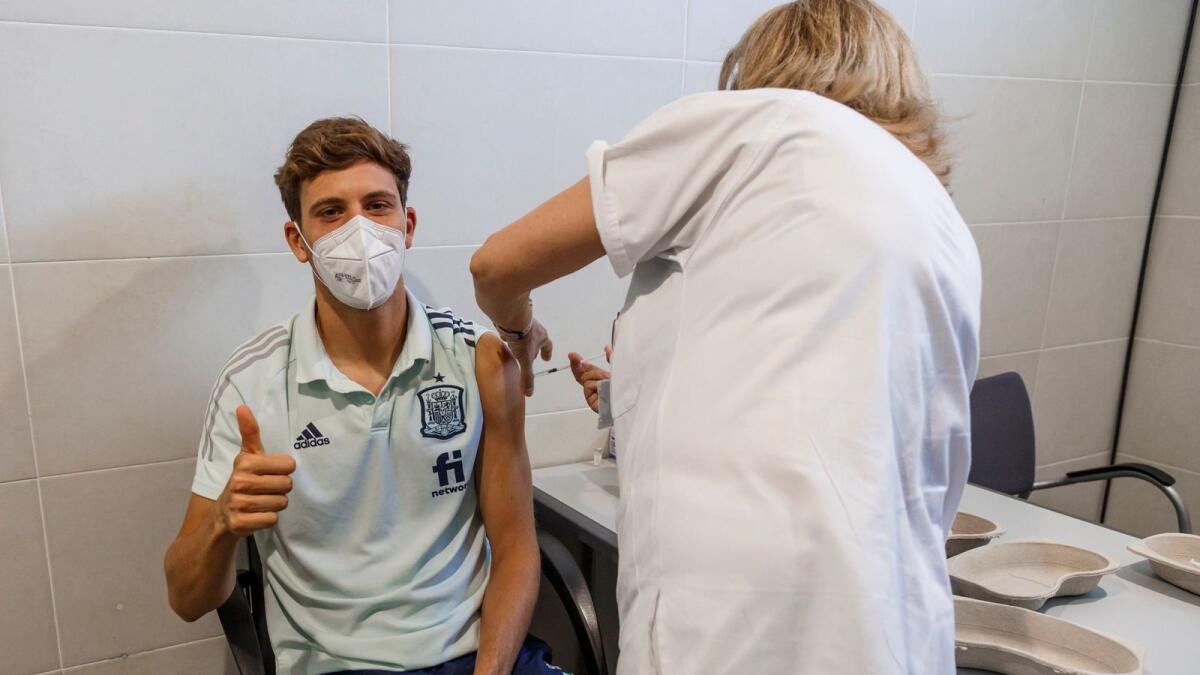 Spain's Marcos Llorente receives a Covid-19 vaccine shot at Las Rozas Sports City in Madrid on Friday. (AP)