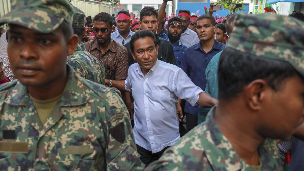 Abdulla Yameen, centre, surrounded by his body guards arrives to address his supporters in Male, Maldives, on February 3, 2018. — AP file