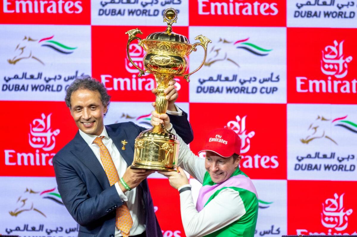 Trainer Bhupat Seemar and jockey Tadhag O'Shea celebrate the Dubai World Cup Victory. — Photo by Shihab