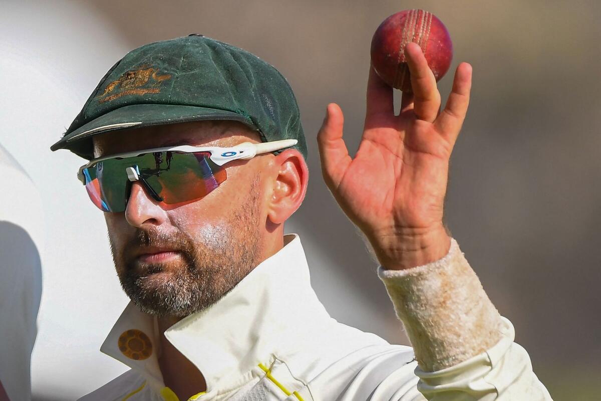 Australia's Nathan Lyon celebrates after taking five wickets. (AFP)
