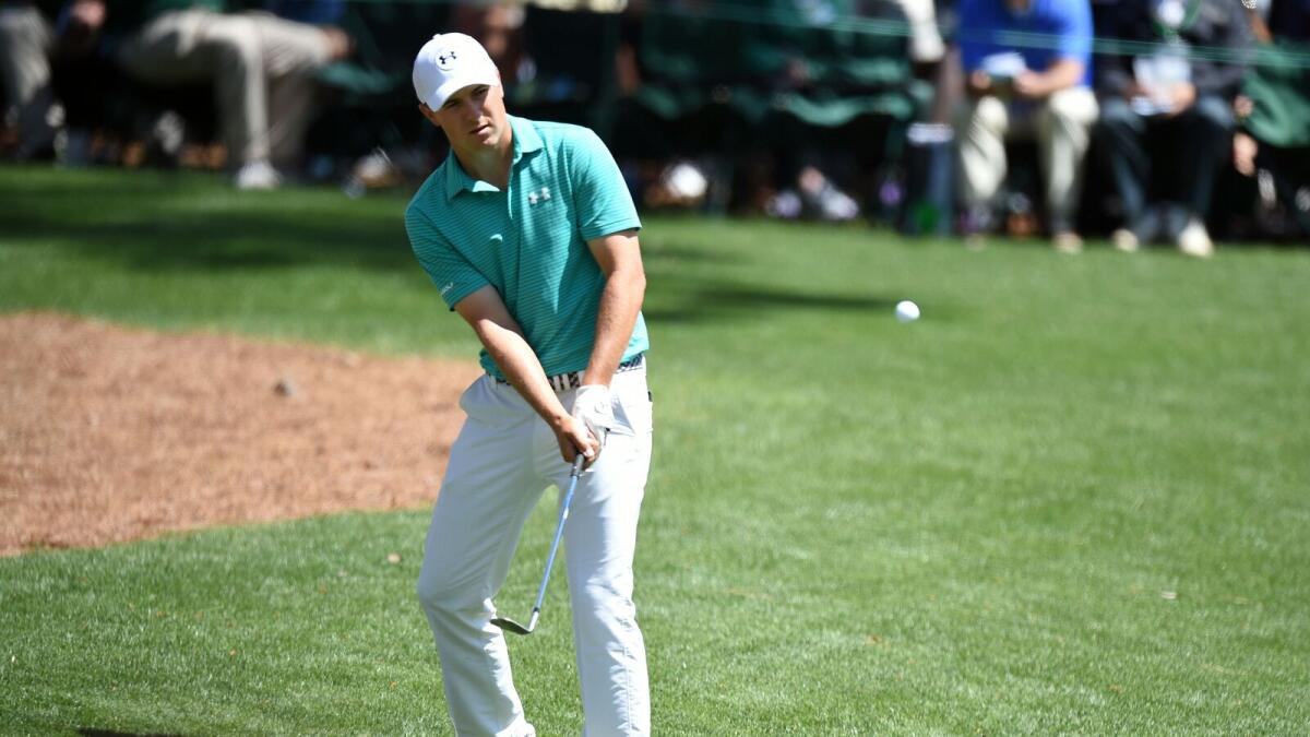 Jordan Spieth chips on the 16th hole during the Masters Golf Tournament in Augusta, Georgia. — AFP
