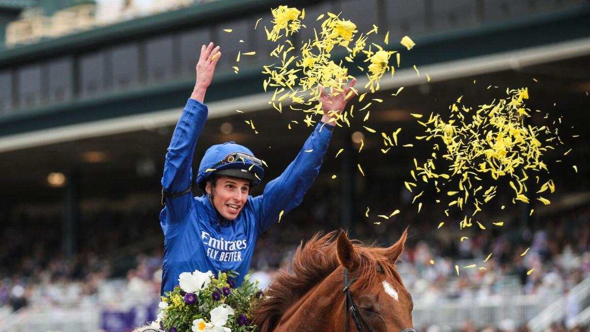 Jockey William Buick celebrates after guiding Modern Games to victory in the $2 million FanDuel Breeders' Cup Mile race at Keeneland in Lexington on Saturday. — Reuters