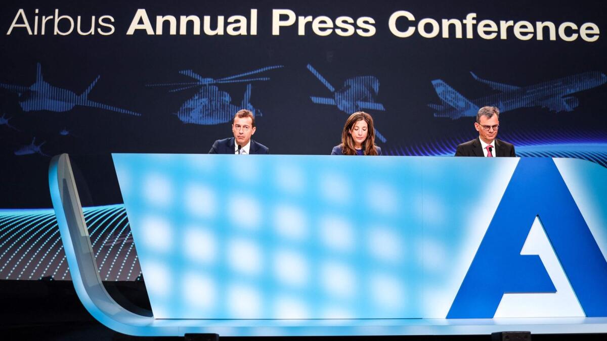From left: Airbus chief executive officer Guillaume Faury, executive vice-president communications and corporate affairs Julie Kitcher and chief financial officer Dominik Asam attend the Airbus Annual press conference in Blagnac, southwestern France on Thursday. - AFP