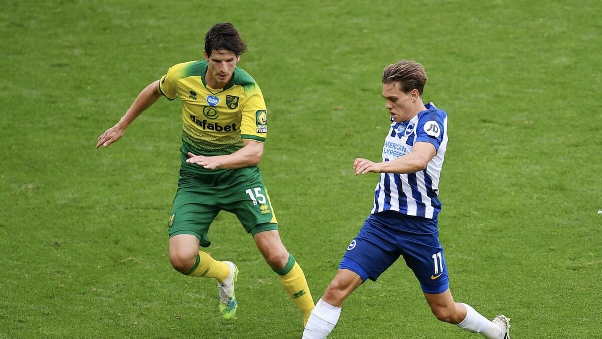 Brighton &amp; Hove Albion's Leandro Trossard (right) tries to get past Norwich City's Timm Klose. - Reuters