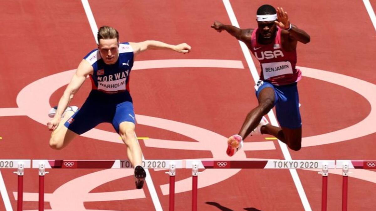 Karsten Warholm of Norway and Rai Benjamin of the United States compete in 400 metres hurdles final. (Reuters)