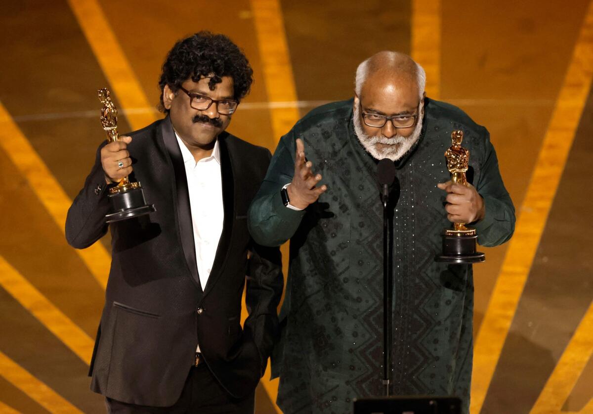 Chandrabose and M. M. Keeravani accept the Best Original Song award for 'Naatu Naatu' from 'RRR' onstage during the 95th Annual Academy Awards. — AFP