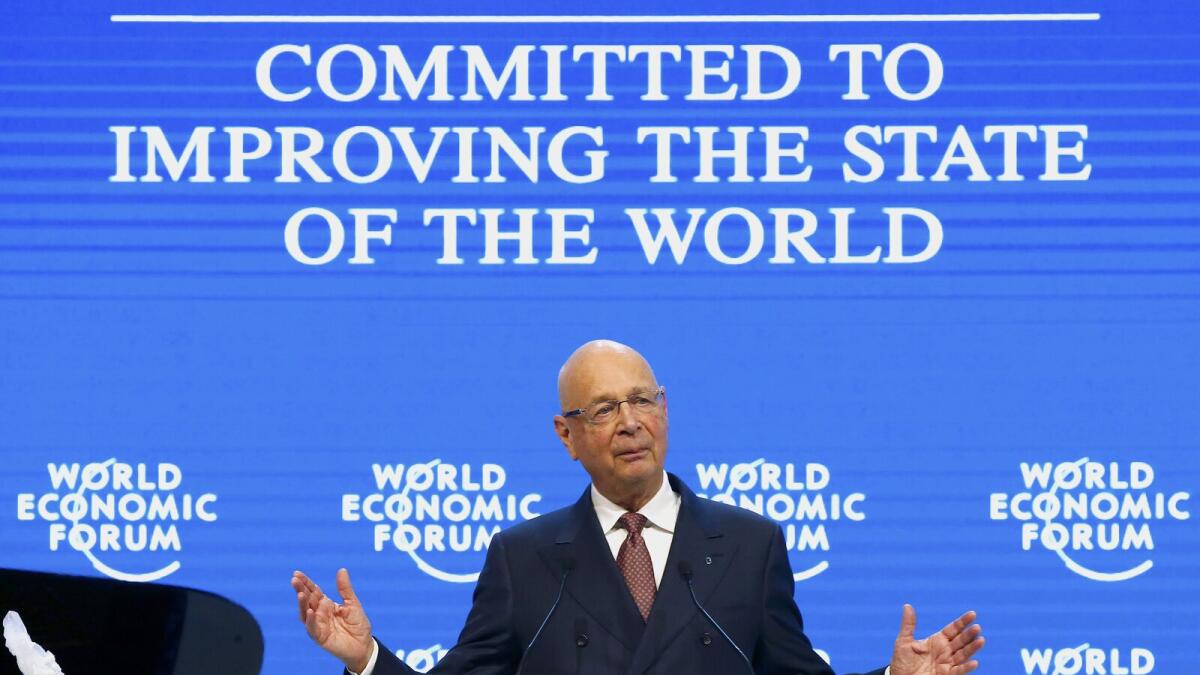 WEF Executive Chairman and founder Klaus Schwab addresses his welcome message to members during the annual meeting of the WEF in Davos.