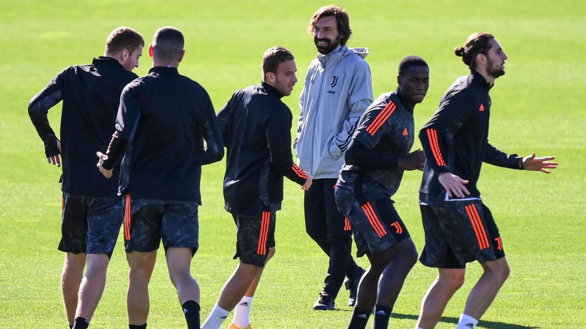 Juventus' coach Andrea Pirlo (third right) attends the players' training session on the eve of the Uefa Champions League group G match against Barcelona. — AFP