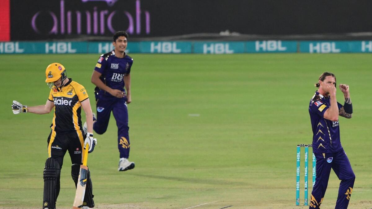 Quetta Gladiators' Dale Steyne (right) celebrates after taking the wicket of Peshawar Zalmi's Tom Cadmore-Kohler during a PSL match. — AFP