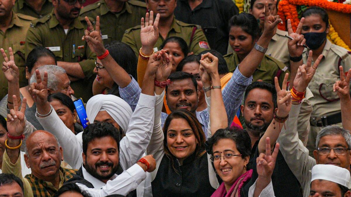 AAP's Shelly Oberoi with party councillors celebrates her victory in the mayoral election, at the Civic Centre in New Delhi on Wednesday. — PTI