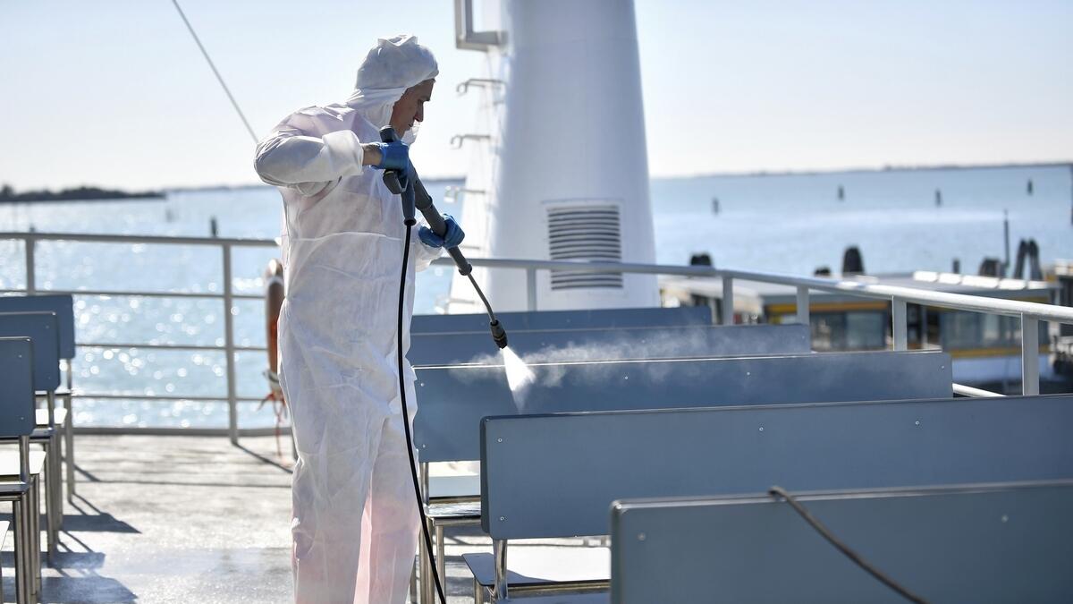 A worker disinfecting a ferry boat in Venice. Italian authorities are taking new measures to sanitise trains and public transportation after the Covid-19 virus outbreak.