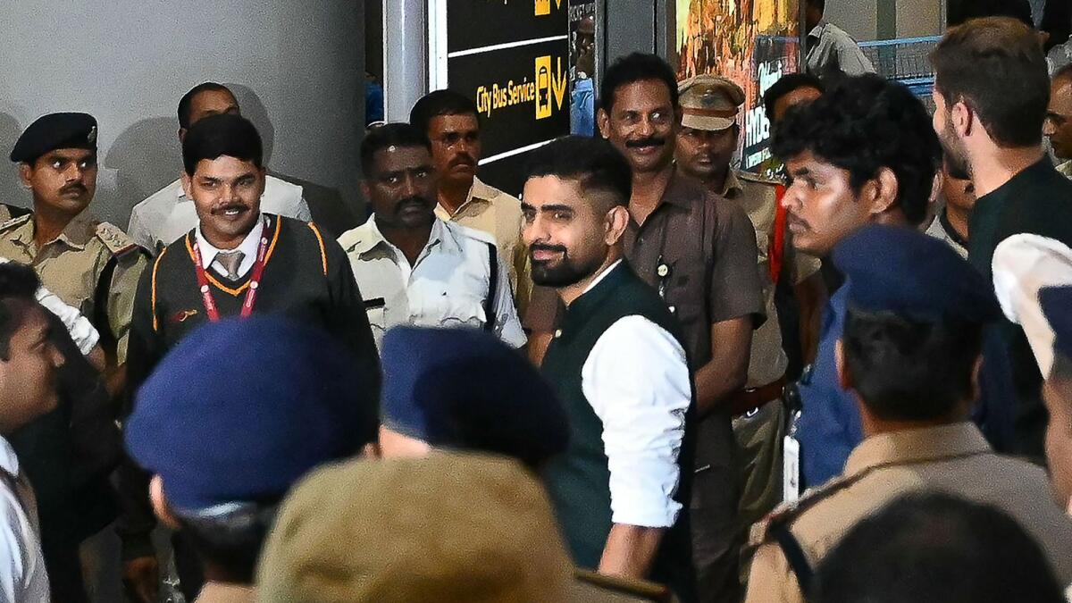 Pakistan’s captain Babar Azam (centre) arrives with team at the Rajiv Gandhi International Airport in Hyderabad on Wednesday. — AFP