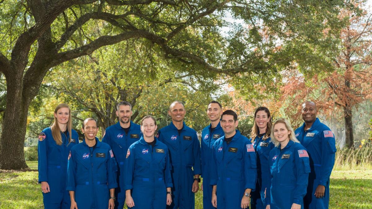 In this photo released by NASA and recieved by AFP on December 6, 2021, Astronaut candidate (ASCAN) Class of 2021 (L-R) Nichole Ayers, Christopher Williams, Luke Delaney,  Jessica Wittner, Anil Menon, Marcos Berrios, Jack Hathaway, Christina Birch, Deniz Burnham, and Andre Douglas pose for a photo at NASA’s Johnson Space Center in Houston, Texas.