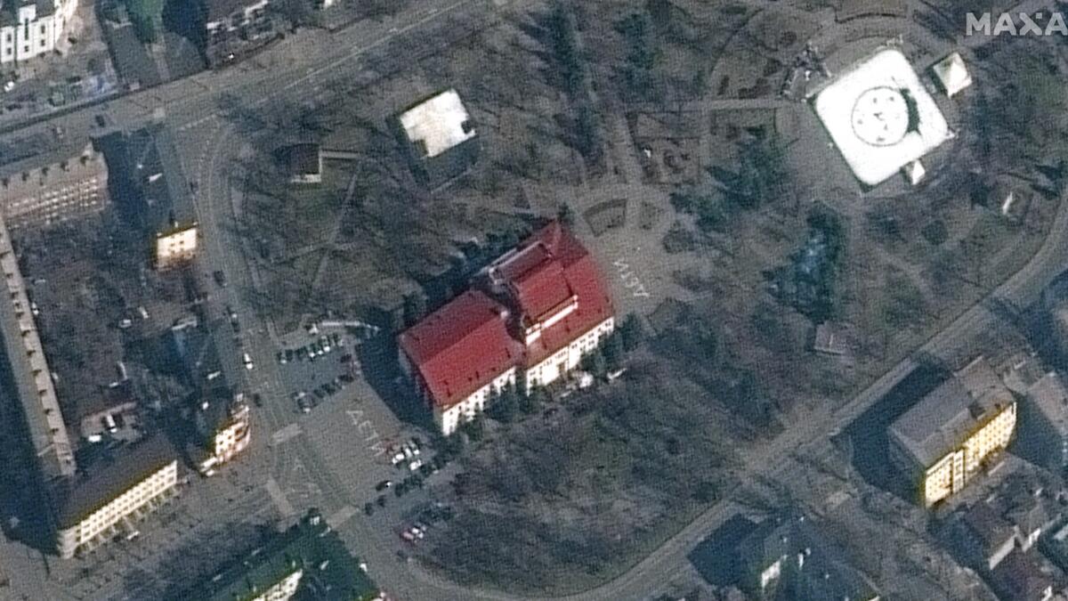 This Maxar satellite image released on March 16, 2022, shows the Mariupol Drama Theater in Mariupol, Ukraine, on March 14, 2022. The building, which had been used as a shelter for hundreds of Ukrainian civilians, had the word “children” written in large white letters (in Russian) on the pavement in front of and behind the theater. It was bombed on March 16, 2022. Photo: AFP