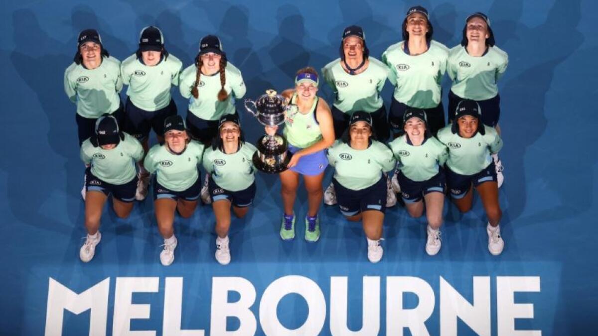 Sofia Kenin of the US celebrates with the trophy and ballkids after winning the 2020 Australian Open. (Reuters)