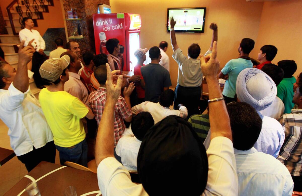 Group of cricket fans enjoy the final of the Indian Premium League (IPL) at the Sindh Punjab Restaurant Bur Dubai. Photo: Rahul Gajjar