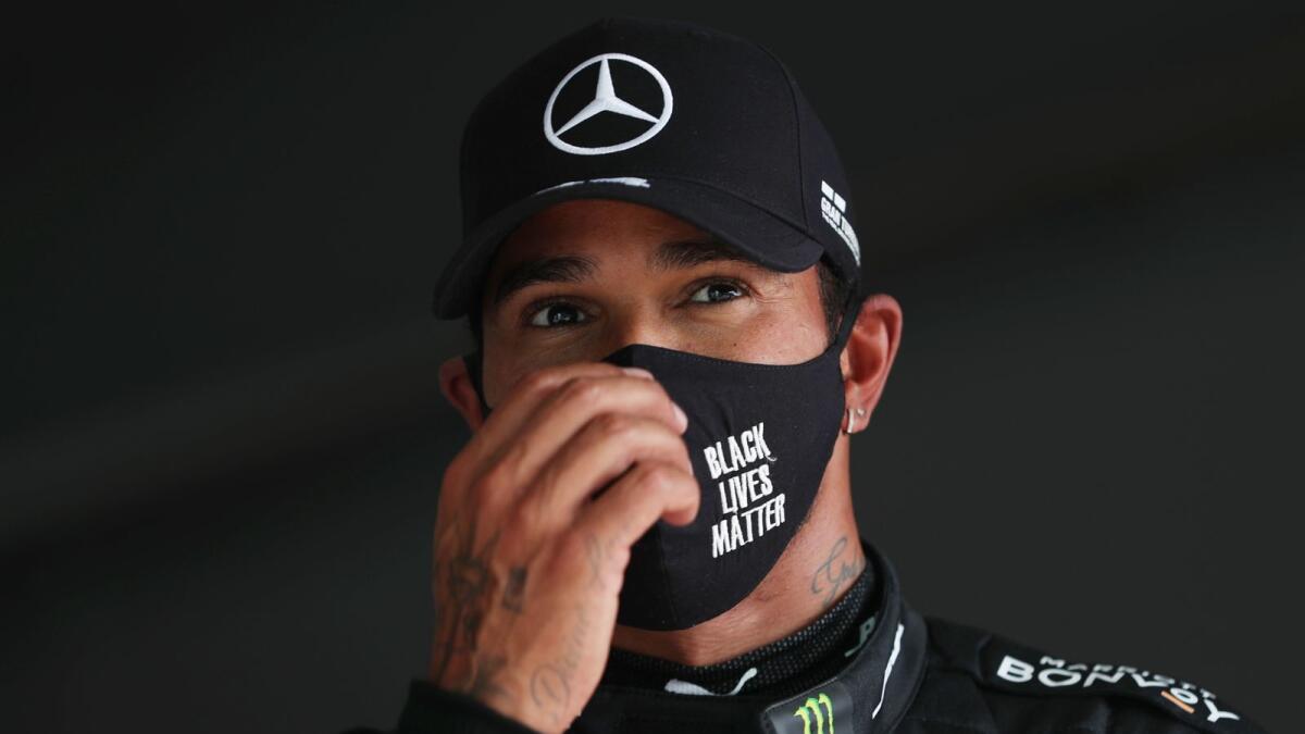 Mercedes' Lewis Hamilton reacts after qualifying in pole position for the Portuguese Grand Prix. — Reuters