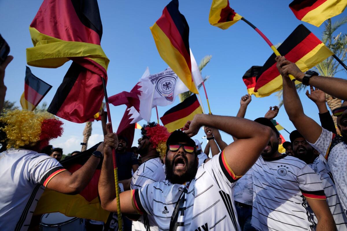 German fans cheer at flag plaza in Doha, Qatar. — AP