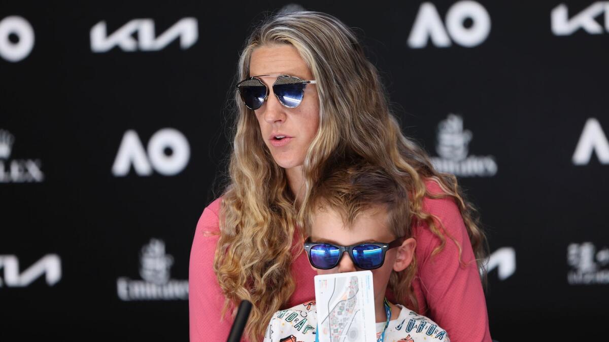 Victoria Azarenka of Belarus sits with her son Leo during a press conference following her third round win over Elina Svitolina of Ukraine. (AP)