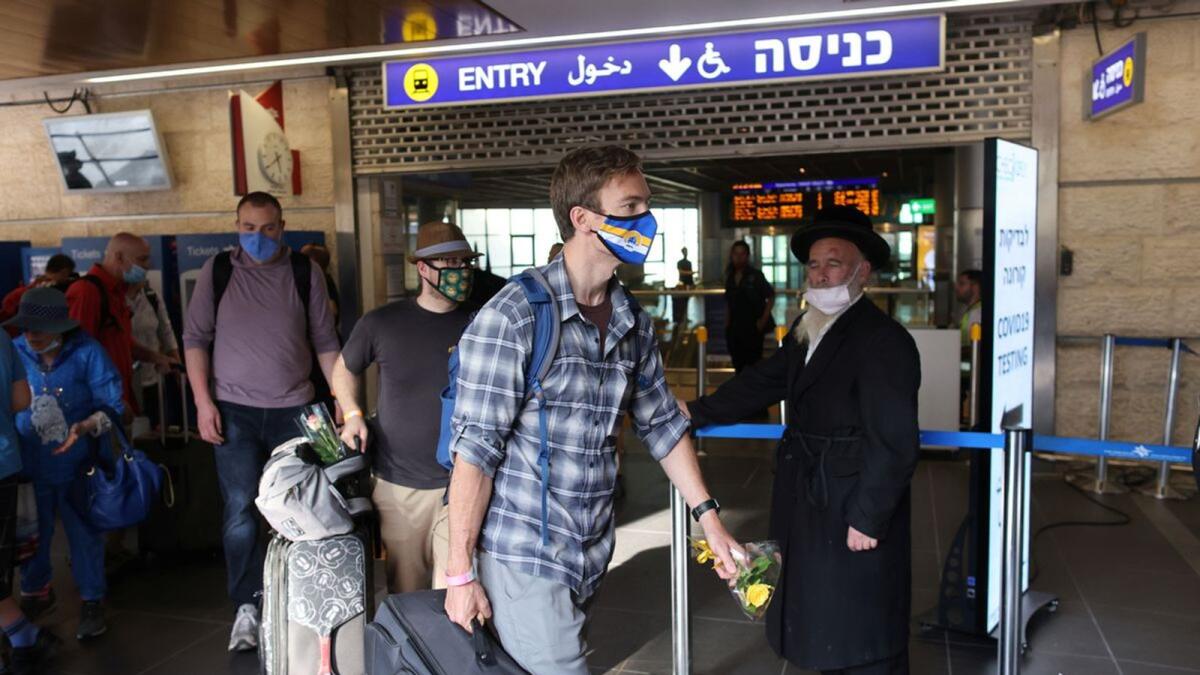 Tourists walk at the Ben Gurion International Airport in Lod, near Tel Aviv, in May. — Reuters file