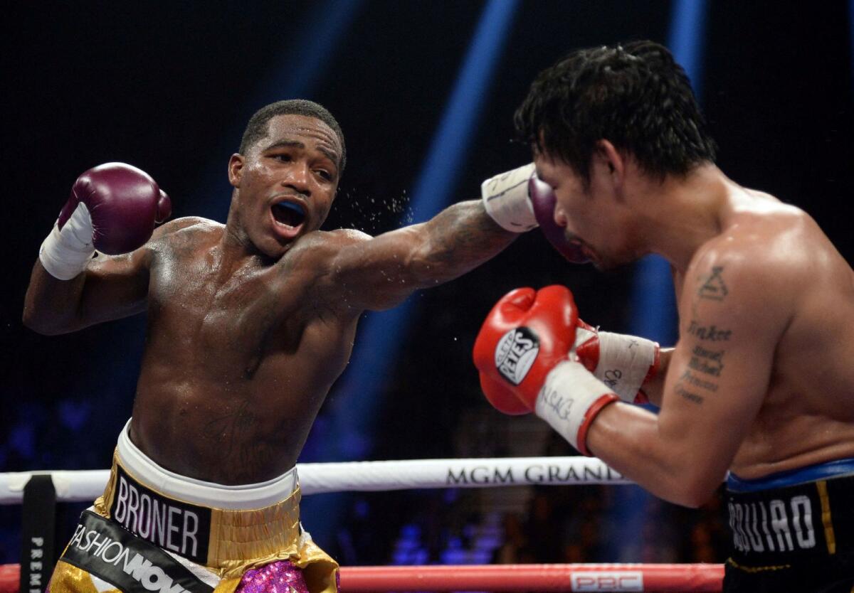 Adrien Broner throws a jab at Manny Pacquiao during a WBA welterweight world title fight at MGM Grand Garden Arena. Pacquiao won via unanimous decision. - USA Today