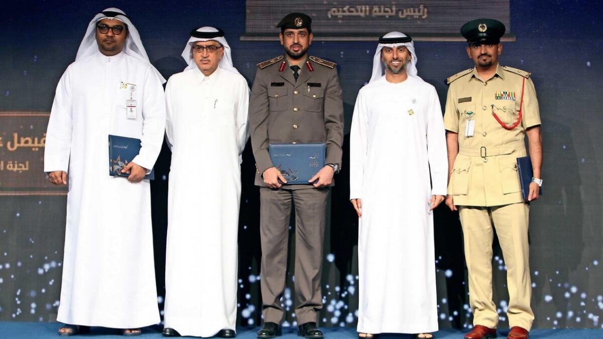 Suhail bin Mohammed Faraj Al Mazroui,  Minister of Energy and Industry, and Mohammed Saleh, with the winners of the Federal Electricity and Water Authority’s excellence awards during a ceremony in Dubai on Monday. — Photo by Shihab