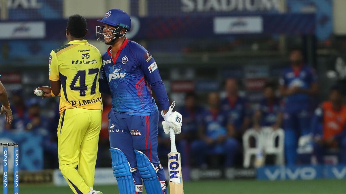 Dwayne Bravo of Chennai Super Kings and Shimron Hetmyer of Delhi Capitals share a light moment during the IPL match on Monday. (BCCI)