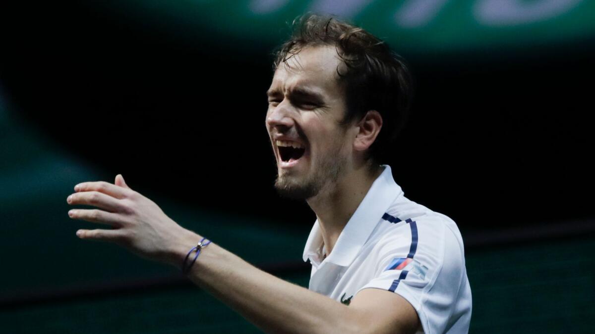 Russia's Daniil Medvedev reacts after missing a shot against Serbia's Dusan Lajovic. (AP)